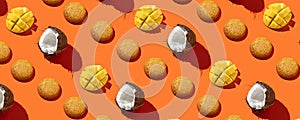 Mango Cookies with coconut in pattern on the orange background. No sugar. Top view  .Healthy and tasty Cookies with protein.