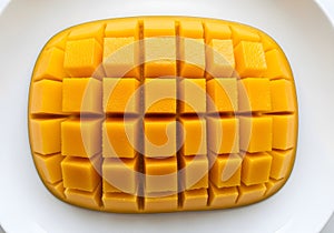 Mango Cubes Arranged on White Plate Overhead