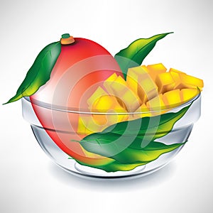 Mango fruit and slices in bowl