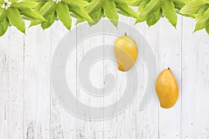 Mango fruit on white wood background