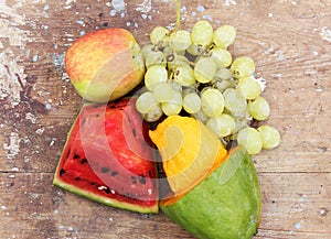 Mango with green grape with water melon and apple fruits