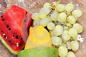 Mango with green grape with water melon fruits