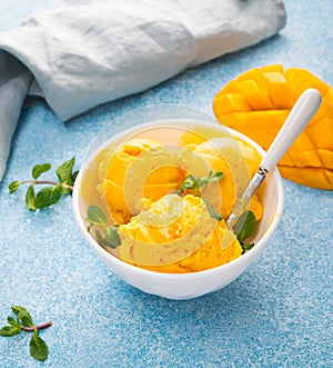 Mango ice cream, sorbet in a plate on a concrete background