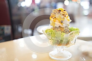 Mango ice cream with sticky rice, close up, parfait served in a tall glass. copy space