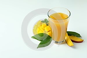 Mango juice and fruit on white background