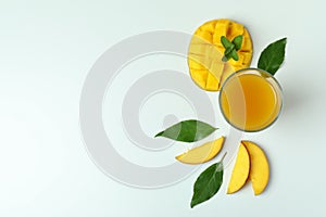 Mango juice and fruit on white background