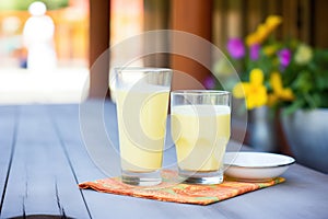 mango lassi on a sunny outdoor table