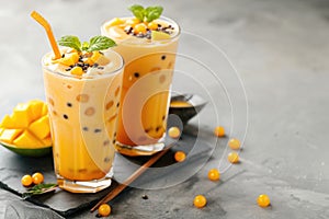Mango milkshake with sweet tapioca balls, Asian bubble tea drink