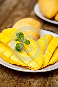 Mango and mint on a wooden table