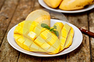 Mango and mint on a wooden table