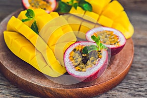 Mango and passion fruit on an old wooden background