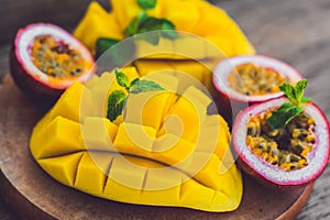 Mango and passion fruit on an old wooden background