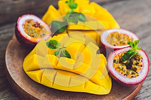 Mango and passion fruit on an old wooden background