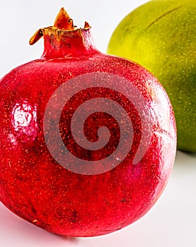 Mango and pomegranate isolated on white background