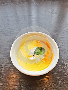 Mango pudding in white cup