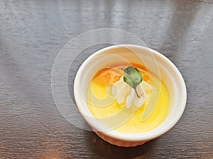 Mango pudding in white cup