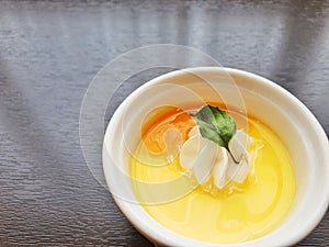 Mango pudding in white cup