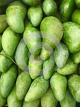 Mango put up for sale. Pictures of green fruits used as background Repeat Pattern. graphic Repetition natural from.