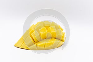 Mango slice with cubes isolated white background