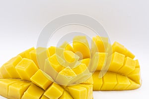 Mango slice with cubes isolated white background