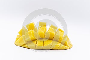 Mango slice with cubes isolated white background