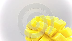 Mango slice with cubes isolated white background