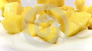 Mango slice with cubes isolated white background