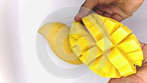 Mango slice with cubes isolated white background