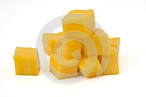 mango slice cut to cubes isolated on white