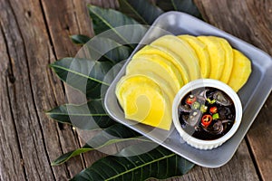 Mango sliced with Sweet fish sauce. Traditional food of Thailand