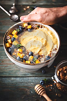 Mango Smoothie Bowl with Mango, Blueberry, Coconut and Granola For Healthy Breakfast