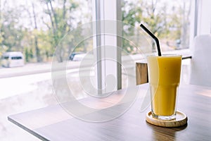 mango smoothie glass in cafe