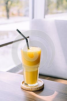 mango smoothie glass in cafe