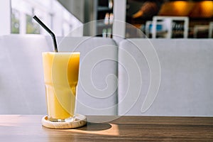 mango smoothie glass in cafe