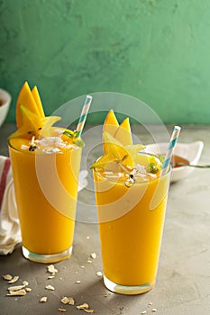 Mango smoothie with honey and coconut