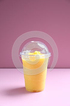 Mango smoothie milk shake with take out glass