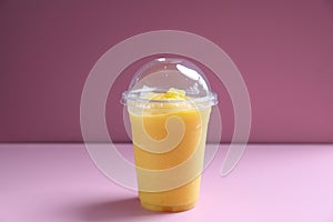 Mango smoothie milk shake with take out glass
