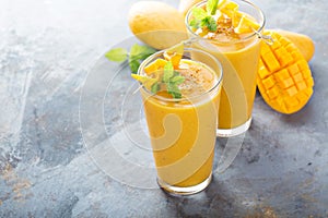 Mango smoothie in tall glasses