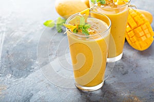 Mango smoothie in tall glasses