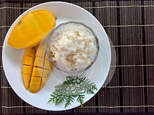 Mango with sticky rice with coconut milk.