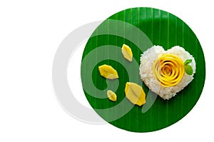 Mango sticky rice & coconut milk decorate as love shape & rose put on banana leaf