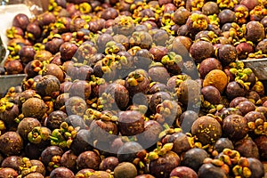 Mangosteen pattern round yellow tropical fruit, counter Asia Vietnam or Malaysia