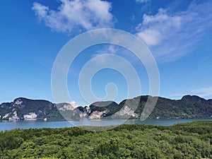 Mangrove forest with sea and mountain Island in the sea with blue sky view. Nature background.