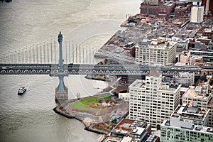 Manhattan Bridge aerial view from helicopter, New York City. City skyline from a high vantage point - NY - USA