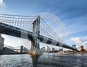 Manhattan Bridge with Brooklyn Bridge and Manhattan Skyline as background - New York, USA