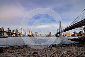 Manhattan Bridge and Brooklyn Bridge spanning the East River in New York City with the Manhattan skyline in the background