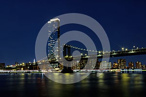 Manhattan Bridge with Brooklyn New York City skyscrapers city over Hudson River New York, night scene