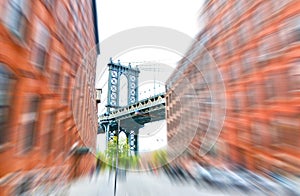 Manhattan Bridge between buildings from Brooklyn