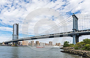 Manhattan Bridge with cloudy sky. New York City, USA