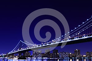 Manhattan Bridge and skyline At Night